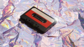 old-cassette-tape-on-crumpled-pink-background-ret-2023-01-27-03-27-09-utc