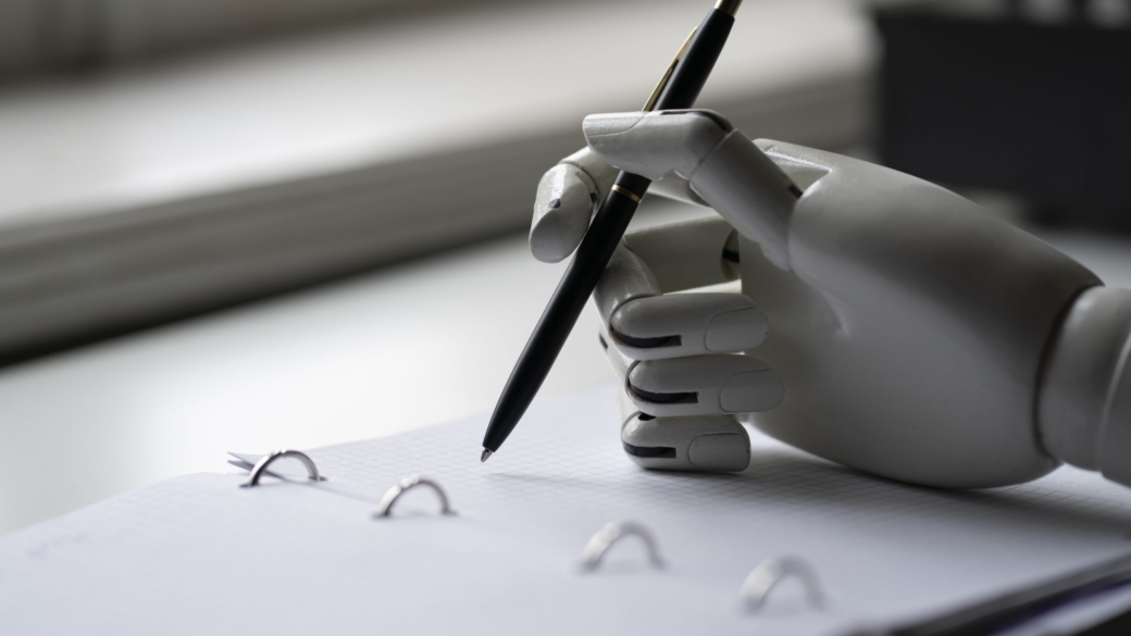 artificial robotic arm write down some notes with pen